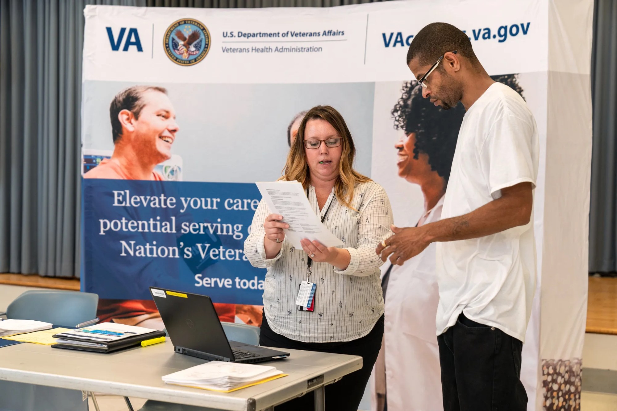 A woman presenting at a VA Fair