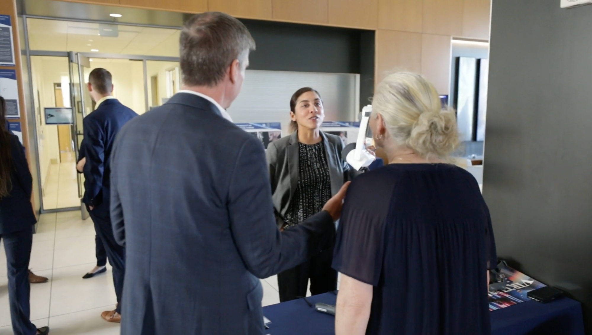 Woman at a VA Job Fair giving advice to a veteran